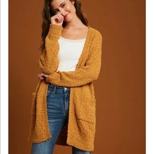 Yellow open cardigan.